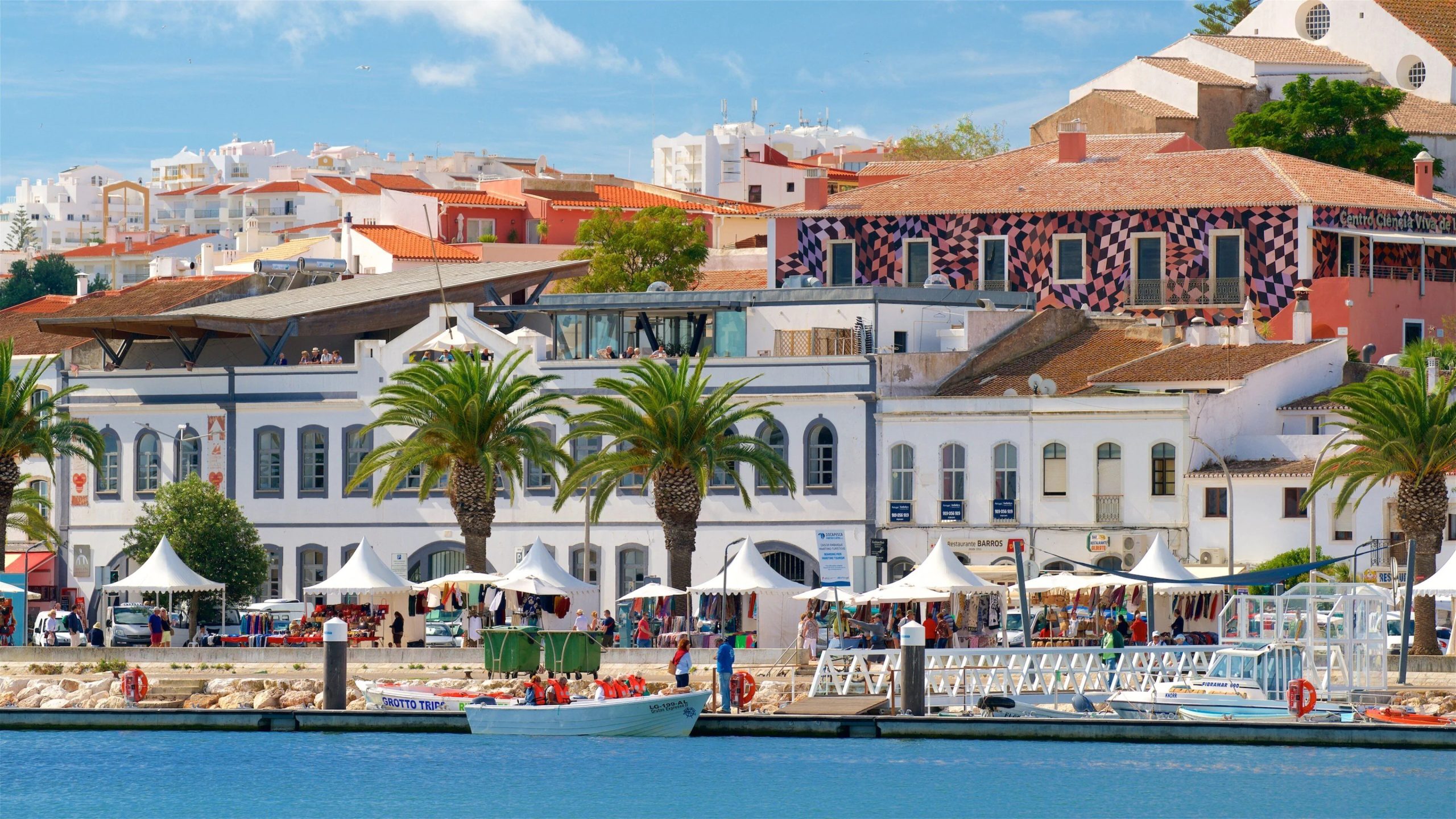 The charming, cobbled streets of Faro's Old Town, lined with traditional whitewashed houses and historic architecture.