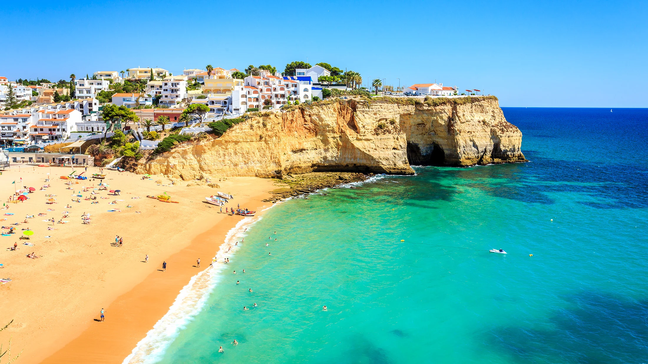 Carvoeiro beach with golden sand and dramatic cliffs
