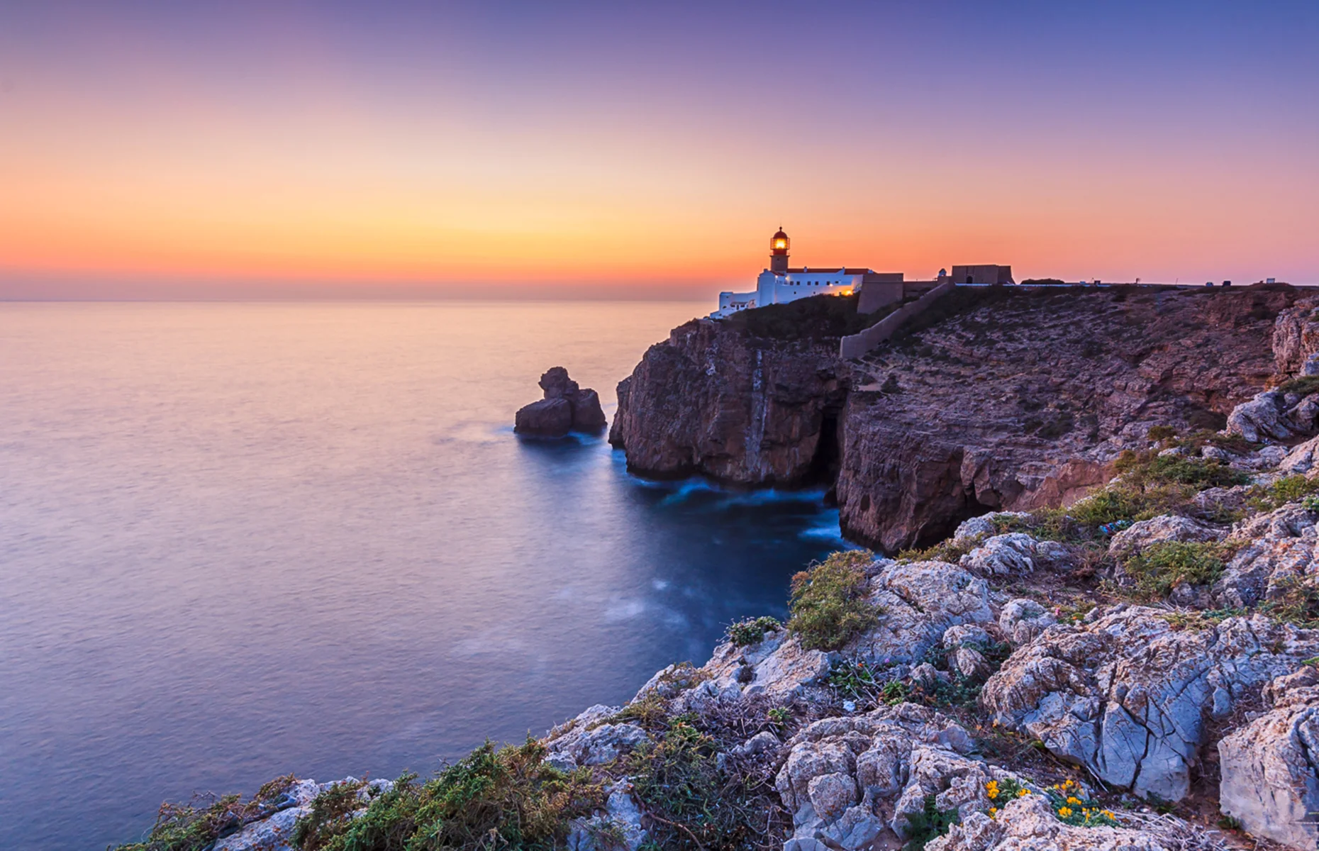 The iconic lighthouse and cliffs of the Cape of St. Vincent near Sagres
